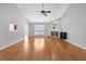 Spacious living room with hardwood floors, fireplace, and vaulted ceiling at 2105 Rock Ct, Loganville, GA 30052