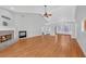 Bright living room featuring hardwood floors and a fireplace at 2105 Rock Ct, Loganville, GA 30052