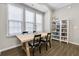 Dining area with a wooden table, chairs, and large windows at 635 Broadview Ne Pl, Atlanta, GA 30324