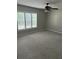 Spacious bedroom with a ceiling fan, carpet flooring, and great natural light at 6494 Pleasant Dr, Winston, GA 30187