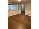 Open dining room featuring hardwood floors, wainscotting, and natural light at 6494 Pleasant Dr, Winston, GA 30187