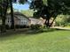 Ranch home with mature trees and a large yard at 6494 Pleasant Dr, Winston, GA 30187