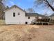 View of the home's back, highlighting the deck and spacious yard at 108 Ridgefield Dr, Douglasville, GA 30134