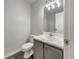 Clean bathroom with gray vanity and a mirrored medicine cabinet at 108 Ridgefield Dr, Douglasville, GA 30134