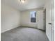 Bright bedroom with gray carpeting and a large window at 108 Ridgefield Dr, Douglasville, GA 30134