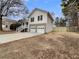 View of the home's exterior from the side, showcasing the two-car garage at 108 Ridgefield Dr, Douglasville, GA 30134