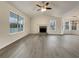 Spacious living room featuring hardwood floors, a stone fireplace, and abundant natural light at 108 Ridgefield Dr, Douglasville, GA 30134