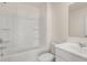 Clean bathroom with shower/tub combo and white vanity at 3238 Champions Way, Loganville, GA 30052