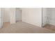 A neutral bedroom showing the bath and closet, complete with neutral carpet and light walls at 3238 Champions Way, Loganville, GA 30052