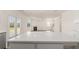 Kitchen island with white quartz countertops at 3238 Champions Way, Loganville, GA 30052