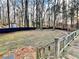 Wooded backyard with deck and privacy fence at 414 Deering Dr, Douglasville, GA 30134