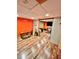 Finished basement with wood flooring and an orange accent wall at 414 Deering Dr, Douglasville, GA 30134