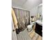 Bathroom with shower/tub combo and dark vanity at 414 Deering Dr, Douglasville, GA 30134