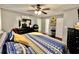 Spacious bedroom with a ceiling fan and large dresser at 414 Deering Dr, Douglasville, GA 30134