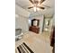 Upstairs bedroom with ceiling fan and wood dresser at 414 Deering Dr, Douglasville, GA 30134