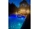 Illuminated above ground pool at night at 414 Deering Dr, Douglasville, GA 30134