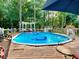 Above ground pool with wooden deck and pergola at 414 Deering Dr, Douglasville, GA 30134