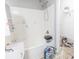 White bathroom with bathtub and shower, needs some cleaning at 131 Magazine St, Dallas, GA 30157