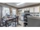 Kitchen with white cabinets and a dining area at 131 Magazine St, Dallas, GA 30157