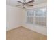 Well-lit bedroom featuring large window and ceiling fan at 190 Wynfield Dr, Covington, GA 30016