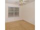 Bedroom with ceiling fan and large window at 190 Wynfield Dr, Covington, GA 30016