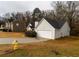 View of the house's side, highlighting the garage and landscaping at 190 Wynfield Dr, Covington, GA 30016