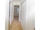 Light-filled hallway with carpet, doors to bedrooms and bathroom at 190 Wynfield Dr, Covington, GA 30016