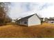 Side view of a single-story house with a small deck at 190 Wynfield Dr, Covington, GA 30016