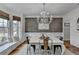 Charming dining room with rustic wall and chandelier at 3350 Vista Creek Dr, Dacula, GA 30019