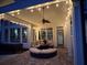 Covered patio with string lights and circular seating at 3350 Vista Creek Dr, Dacula, GA 30019