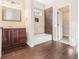 Bathroom with tub, dark tile floor and vanity at 960 N Grand Nw Ave, Atlanta, GA 30318