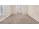 Spacious bedroom with neutral carpet and dormer windows at 960 N Grand Nw Ave, Atlanta, GA 30318