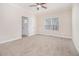 Bright bedroom with neutral carpet and ceiling fan at 960 N Grand Nw Ave, Atlanta, GA 30318