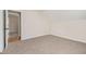 Simple bedroom with carpet and door to another room at 960 N Grand Nw Ave, Atlanta, GA 30318