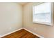 Simple bedroom with hardwood floors and a window at 2600 Nw Baker Rd, Atlanta, GA 30318