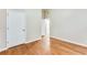 Hardwood floor bedroom with door to bathroom and closet at 2600 Nw Baker Rd, Atlanta, GA 30318