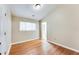 Bedroom with hardwood floors, window, and access to patio at 2600 Nw Baker Rd, Atlanta, GA 30318