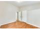 Bedroom with hardwood floors, and doors to hallway and bathroom at 2600 Nw Baker Rd, Atlanta, GA 30318