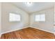 Spacious bedroom with hardwood floors and two windows at 2600 Nw Baker Rd, Atlanta, GA 30318