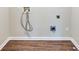 Clean laundry room with vinyl flooring and space for washer and dryer at 2600 Nw Baker Rd, Atlanta, GA 30318