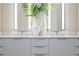 Elegant bathroom vanity with quartz countertop and modern fixtures at 40 12Th Ne St # 1004, Atlanta, GA 30309