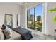 Main bedroom with floor to ceiling windows and city views at 40 12Th Ne St # 1004, Atlanta, GA 30309