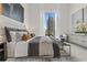 Main bedroom with king-size bed and city views at 40 12Th Ne St # 1004, Atlanta, GA 30309