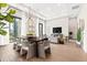 Open concept dining area with modern chandelier and hardwood floors at 40 12Th Ne St # 1004, Atlanta, GA 30309
