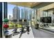 Fitness center with cardio equipment and city views at 40 12Th Ne St # 1004, Atlanta, GA 30309