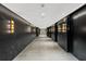 Modern hallway with dark marble walls and elegant lighting at 40 12Th Ne St # 1004, Atlanta, GA 30309