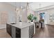 Gourmet kitchen with island seating and wine refrigerator at 40 12Th Ne St # 1004, Atlanta, GA 30309