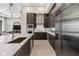 Sleek kitchen with dark cabinetry and stainless steel appliances at 40 12Th Ne St # 1004, Atlanta, GA 30309