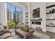 Bright living room featuring floor-to-ceiling windows and city views at 40 12Th Ne St # 1004, Atlanta, GA 30309