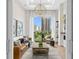 Relaxing living room with leather sofas, city views, and a modern fireplace at 40 12Th Ne St # 1004, Atlanta, GA 30309